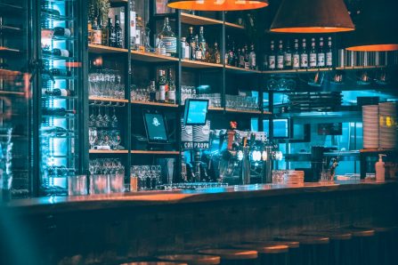 brown wooden shelf with bottles